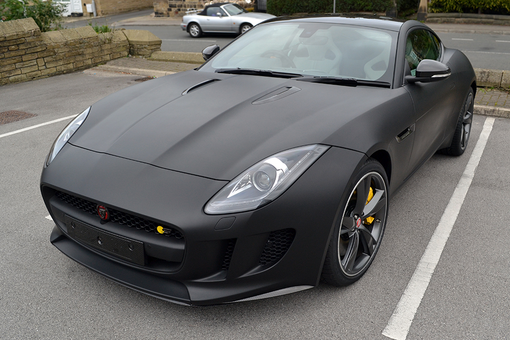 https://reforma-uk.com/wp-content/uploads/2015/12/Jaguar-F-Type-Matte-Black-Angled-Outside.jpg